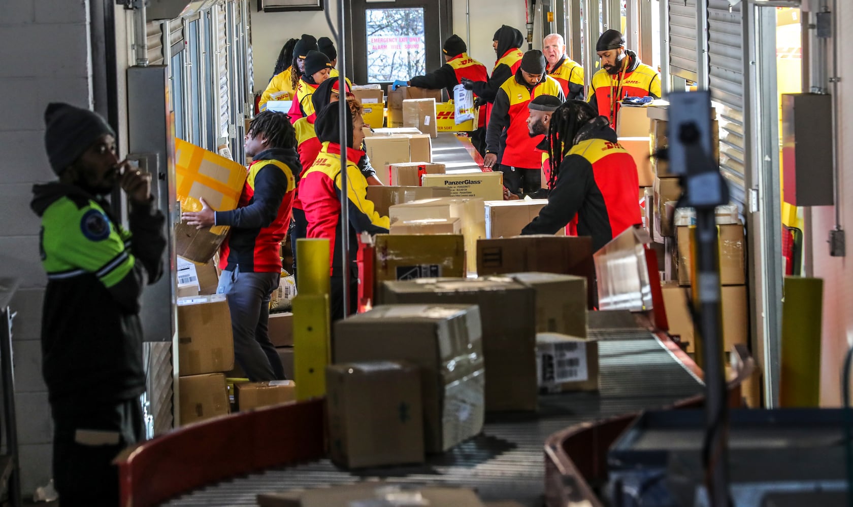 December 15, 2022 ATLANTA: DHL Express handles international shipments to and from the U.S., and station services Ray Aylward said he has seen about a 15% bump up in package volume for the peak holiday period compared with the rest of the year. (John Spink / John.Spink@ajc.com)

