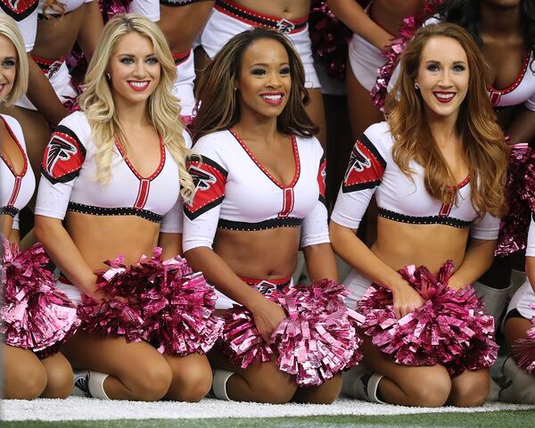 October 23, 2016 Atlanta: The Falcons cheerleaders wear throw back uniforms and sport pink for breast cancer awareness while they perform during an NFL football game against the Chargers on Sunday, Oct. 23, 2016, in Atlanta. Curtis Compton /ccompton@ajc.com October 23, 2016 Atlanta: in an NFL football game on Sunday, Oct. 23, 2016, in Atlanta. Curtis Compton /ccompton@ajc.com