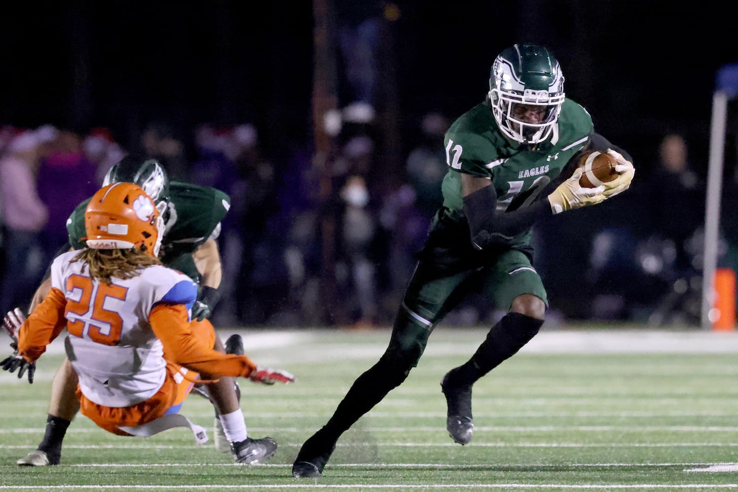 Collins Hill wide receiver Travis Hunter (12) runs after a catch during a game against Parkview in the Class AAAAAAA quarterfinal game at Collins Hill high school Friday, December 11, 2020 in Suwanee, Ga.. Collins Hill won 21-14. JASON GETZ FOR THE ATLANTA JOURNAL-CONSTITUTION



