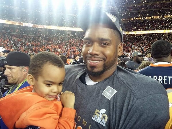 Former Georgia Tech defensive tackle Vance Walker celebrating winning the Super Bowl with son, Vaylen, in 2016 as a member of the Denver Broncos. (Photo courtesy Vance Walker)