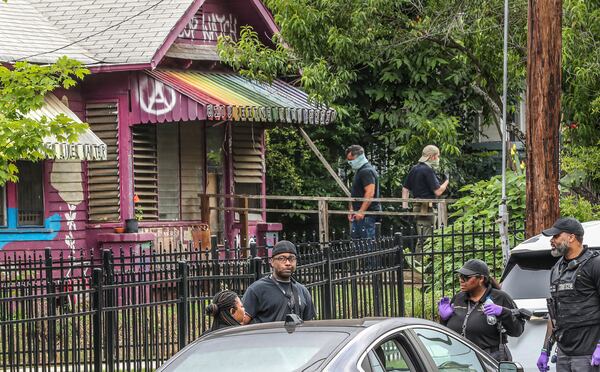 May 31, 2023 Atlanta: Atlanta Police Officers and GBI agents were at the Teardown House on Mayson Avenue in Atlanta conducting a search warrant. Three people were arrested and charged with crimes related to the Atlanta Public Safety Center.
 (John Spink / John.Spink@ajc.com)

