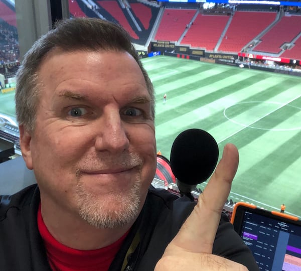 Steve Craig at the mic at Mercedes-Benz Stadium before an Atlanta United game. CREDIT: Contributed