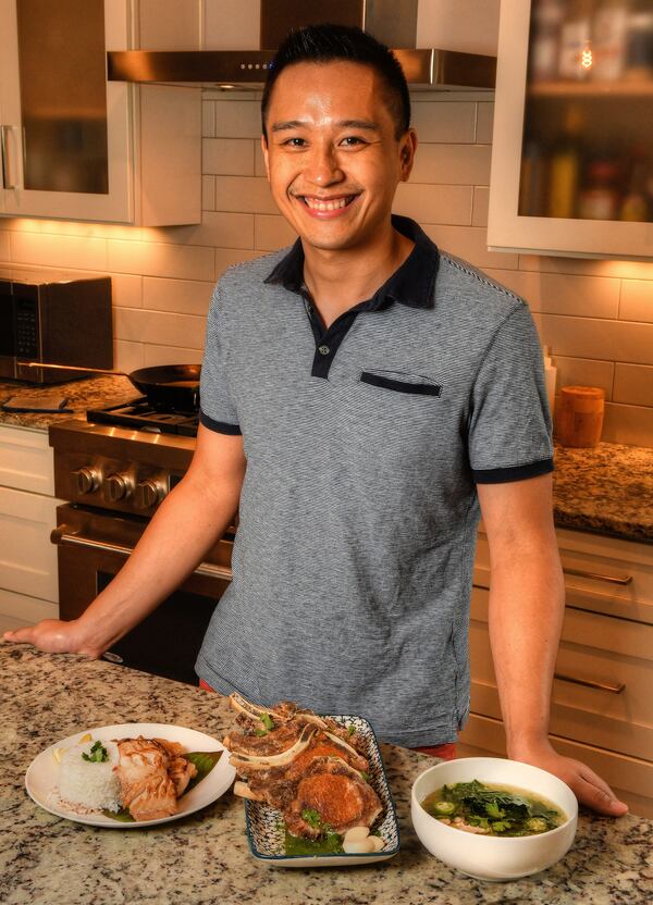 Mike Pimentel, founder of Filipino pop-up Adobo ATL, is shown at his Decatur home with his Filipino recipes: (from left) Bistek na Isda (sauteed cod with onions), Fried Adobo Pork Chops and Suam Na Mais (a Filipino corn soup). Styling by Mike Pimentel / Chris Hunt for The Atlanta Journal-Constitution