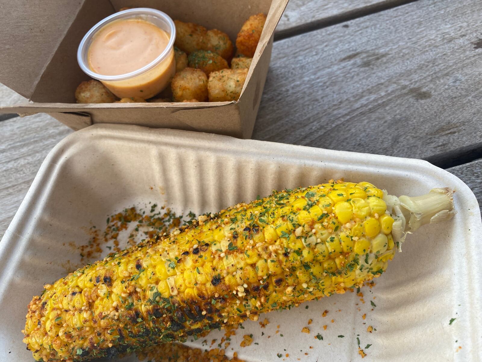 Osha Farm Grill offers a handful of small bites that hold bold flavors, including Grilled Coco Corn and Cajun Tater Tots. (Ligaya Figueras / ligaya.figueras@ajc.com)