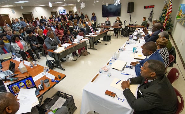 A crowd packs a room at the South Fulton City Hall during a hearing to remove Mayor Bill Edwards and councilwoman Helen Zenobia Willis, Dec. 30, 2019. STEVE SCHAEFER / SPECIAL TO THE AJC