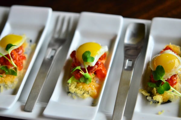 Eggs Benedict with crispy rice, spicy tuna, shiso leaf, sunny side up quail egg. (Eight Sushi Lounge)