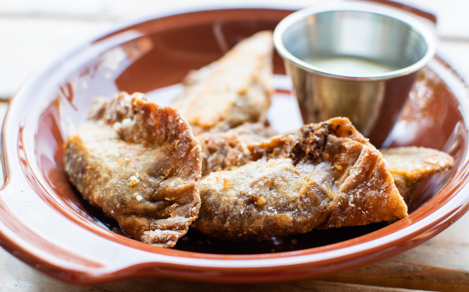 The plantain empanadas at Porch Light Latin Kitchen have a decidedly rustic appearance. CONTRIBUTED BY HENRI HOLLIS