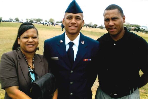 Anthony Hill and his parents: Anthony Hill Sr. and Carolyn Baylor Giummo. AJC file