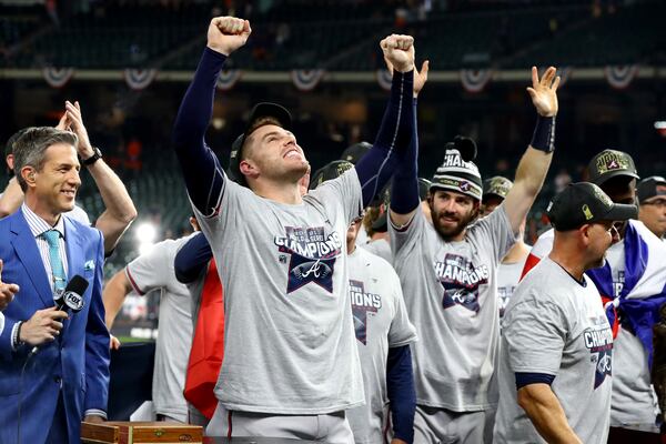  Braves first baseman Freddie Freeman and shortstop Dansby Swanson (7) celebrate after defeating the Houston Astros 7-0 in game six of the World Series at Minute Maid Park, Tuesday, November 2, 2021, in Houston, Tx. The Atlanta Braves beats the Houston Astros 4-2 to take the World Series. Curtis Compton / curtis.compton@ajc.com