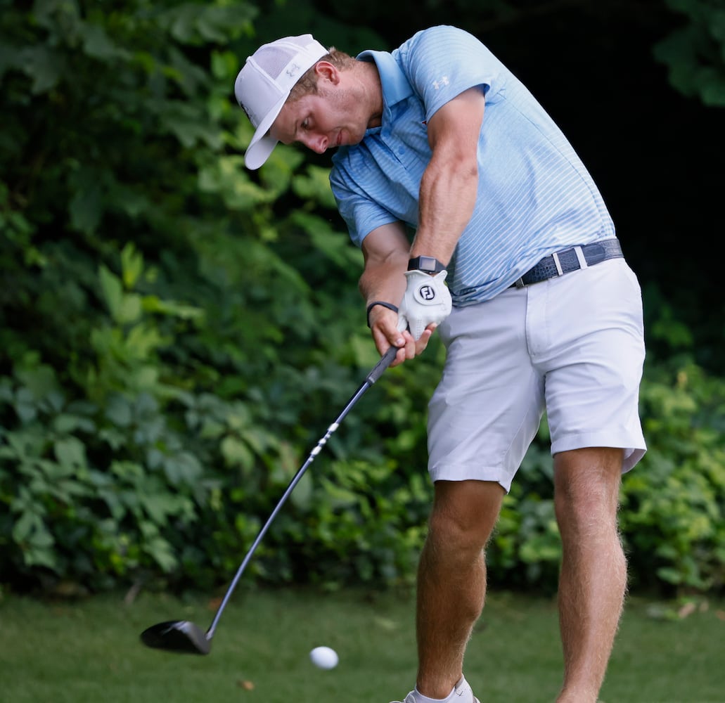 Carson Bacha, from Auburn University, who finished first, hits from the fifth tee during the final round of the Dogwood Invitational Golf Tournament in Atlanta on Saturday, June 11, 2022.   (Bob Andres for the Atlanta Journal Constitution)