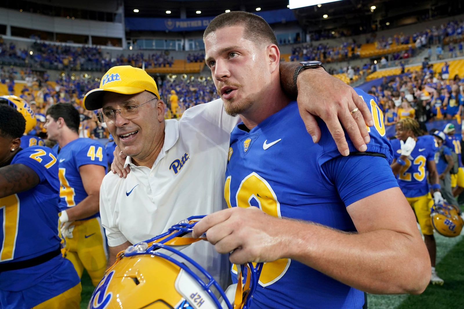 FILE - Pittsburgh head coach Pat Narduzzi, left, celebrates with quarterback Eli Holstein, right, after defeating West Virginia in an NCAA college football game, Sept. 14, 2024, in Pittsburgh. (AP Photo/Matt Freed, File)