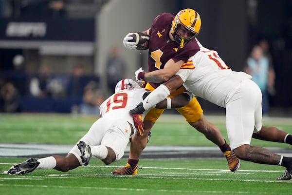 Arizona State features running back Cam Skattebo (4), who finished fifth in the Heisman Trophy voting. Texas will count on its Top 10 run defense to slow the Sun Devils in the Chick-fil-A Peach Bowl on Jan. 1 in Atlanta. (AP Photo/LM Otero)