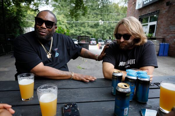 Rapper Killer Mike and Peter Kiley, brewmaster at Monday Night Brewery, speak during an interview with The Atlanta Journal-Constitution about their partnership to benefit the nonprofit organization PAWKids. (Photo: Miguel Martinez / miguel.martinezjimenez@ajc.com)