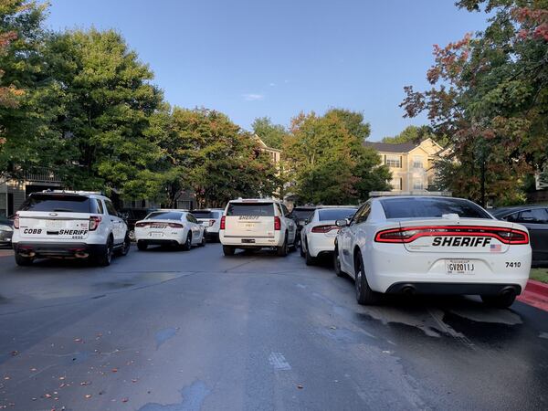 Vehicles from the Cobb County Sheriff's Office were gathered at the apartment complex where Tyrell Daniels was arrested.