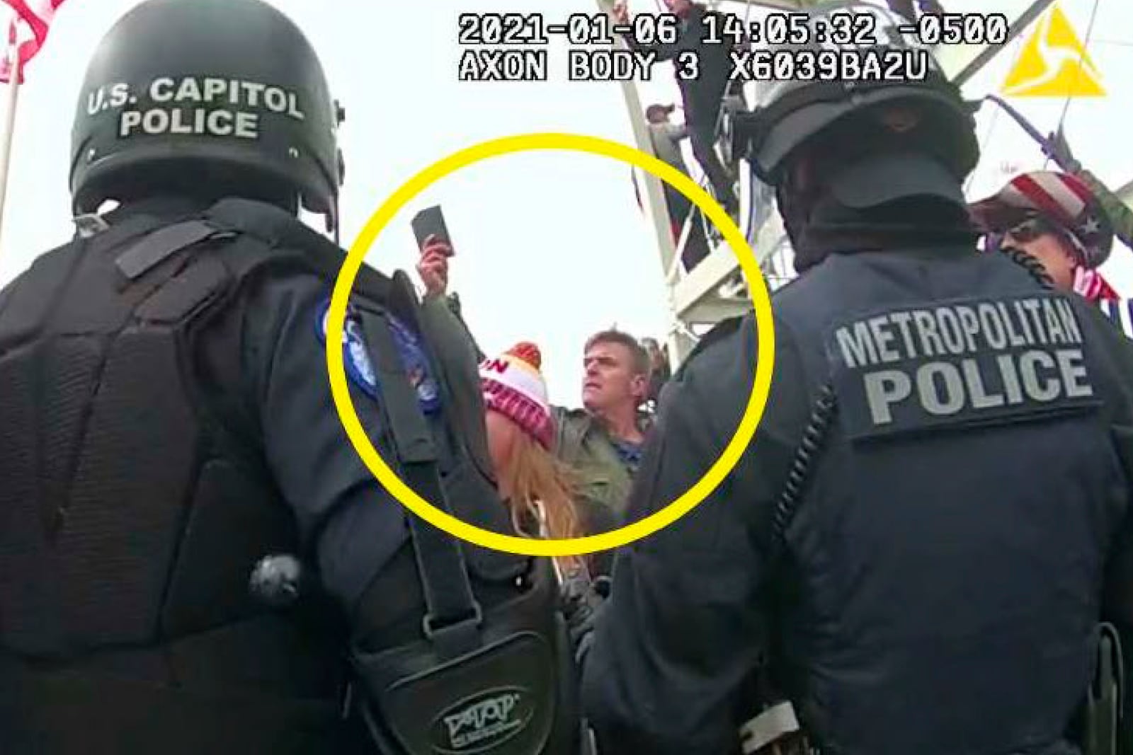 FILE - This image from Washington Metropolitan Police Department body-worn video, released and annotated by the Justice Department in the statement of facts supporting an arrest warrant for Jay James Johnston, shows Johnston, circled in yellow, at the U.S. Capitol on Jan. 6, 2021, in Washington. (Justice Department via AP, File)