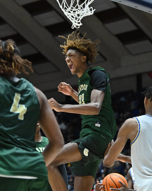 Grayson's Jacob Wilkins (21) reacts after dunking the ball during the second half of GHSA Basketball Class 7A Boy’s State Championship game at the Macon Centreplex, Saturday, Mar. 9, 2024, in Macon. Grayson won 51-41 over McEachern. (Hyosub Shin / Hyosub.Shin@ajc.com)