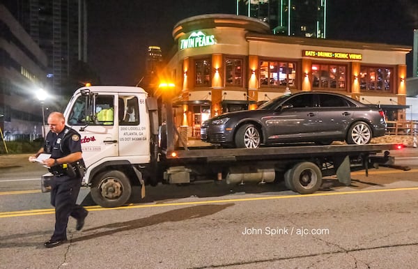 A man's car was towed from the Hampton Inn on Piedmont Road after he was shot while driving, police said. He drove to the hotel looking for help. JOHN SPINK / JSPINK@AJC.COM