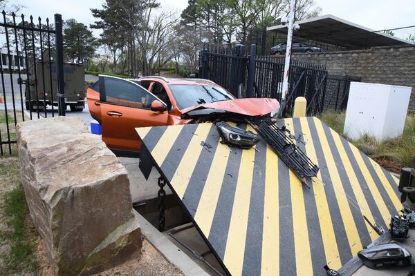 Photos from the affidavit for a federal arrest warrant show the damage to a security barrier caused by a Buick Encore ramming it Monday.