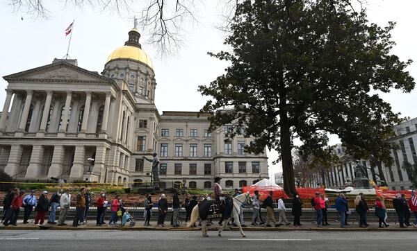 Participants march around the state Capitol during the Georgia Prayer March event in Atlanta on Saturday, January 2, 2021. (Hyosub Shin / Hyosub.Shin@ajc.com)