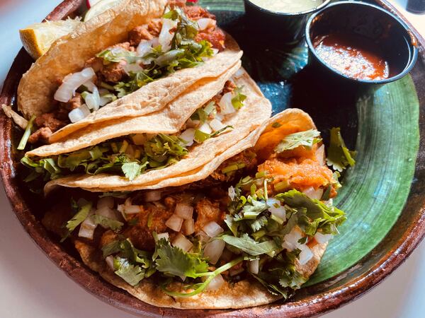 Mexican-style tacos on corn or flour tortillas, with cilantro and hot sauces, are popular at Cylantro’s. Bob Townsend for The Atlanta Journal-Constitution.