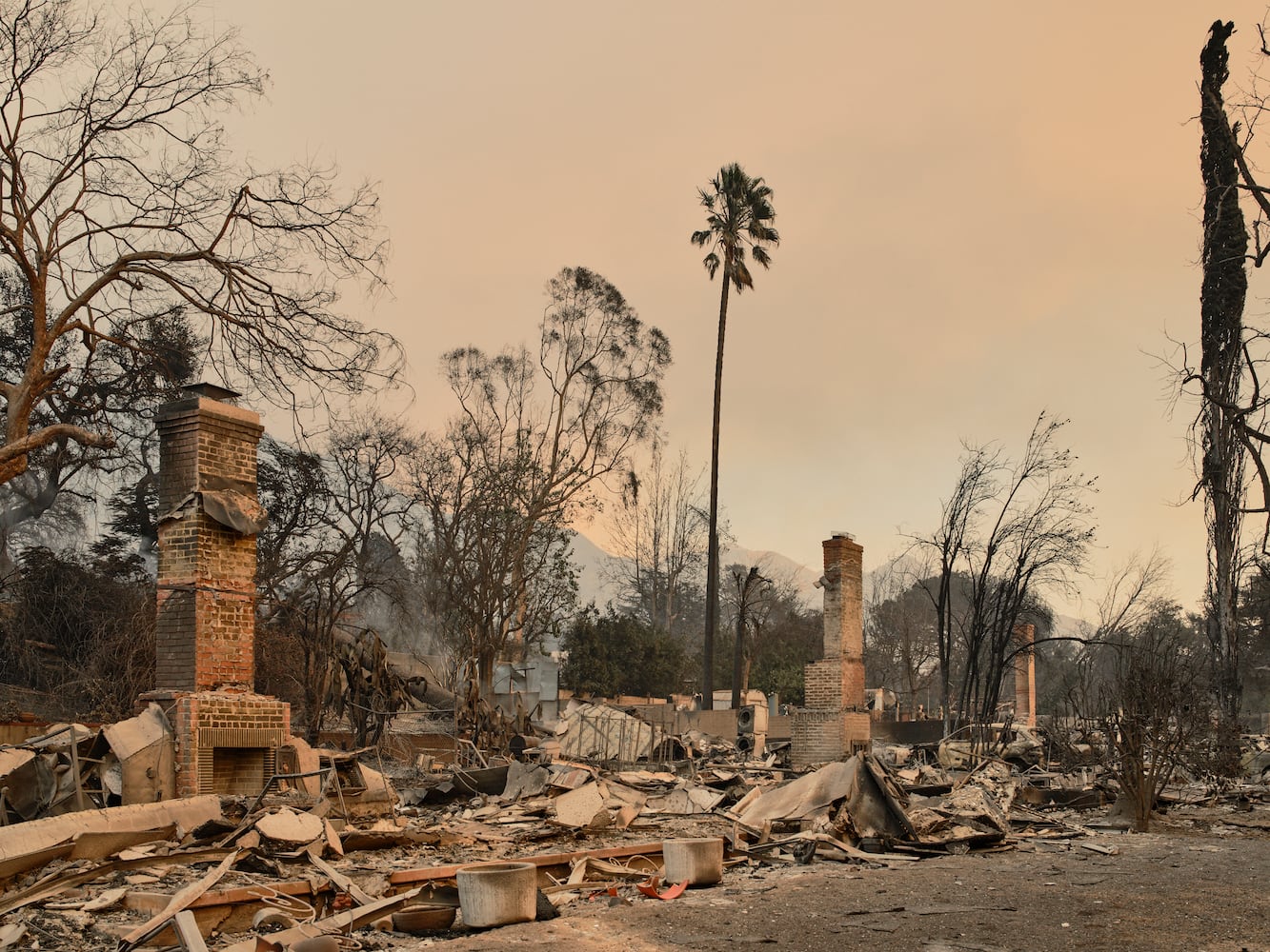 Destroyed homes on East Las Flores Drive amid the Eaton fire in Altadena, Calif., on Thursday, Jan. 9, 2025. (Philip Cheung/The New York Times)