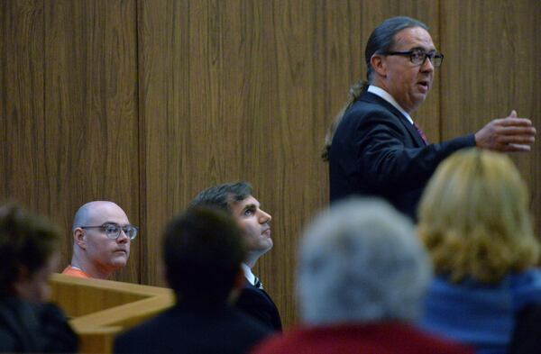 From left, Justin Chapman and attorneys Mike Caplan and Frank Hogue