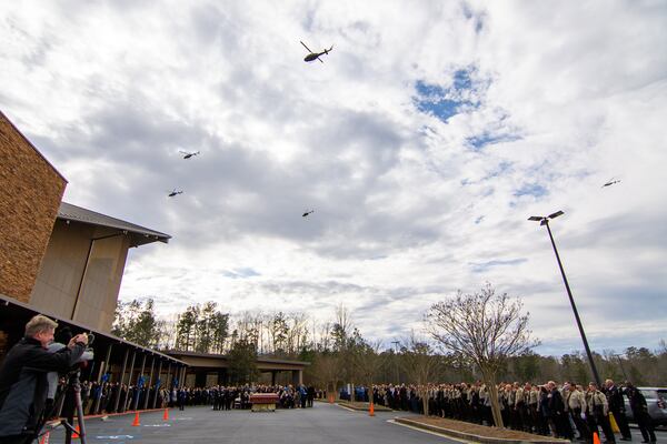 Helicopters flyover during Coweta County Sheriff’s Office Eric Anthony Minix's service at Crossroads Church in Sharpsburg, GA, Monday, January 8, 2024. Investigator Minix passed away during the apprehension of a vehicle theft suspect on Thursday, January 4, 2024. (Jamie Spaar for the Atlanta Journal Constitution)