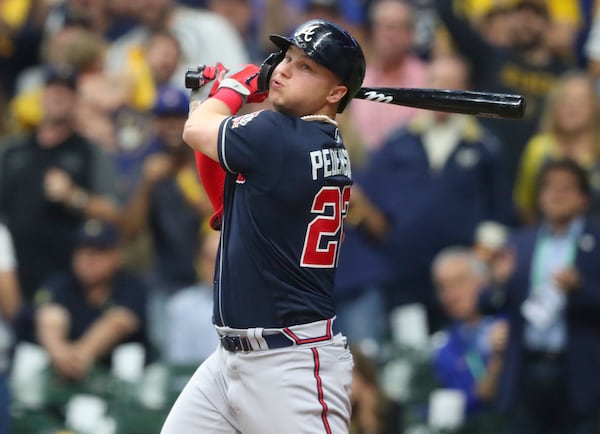 Braves left fielder Joc Pederson (22) hits a solo home run in the eighth inning.  Curtis Compton / Curtis.Compton@ajc.com 