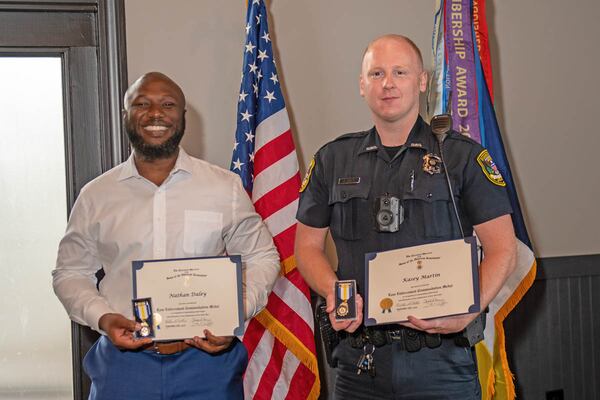 The Mount Vernon Chapter of the Sons of the American Revolution honored Dunwoody officers Nathan Daley (left) and Kasey Martin.