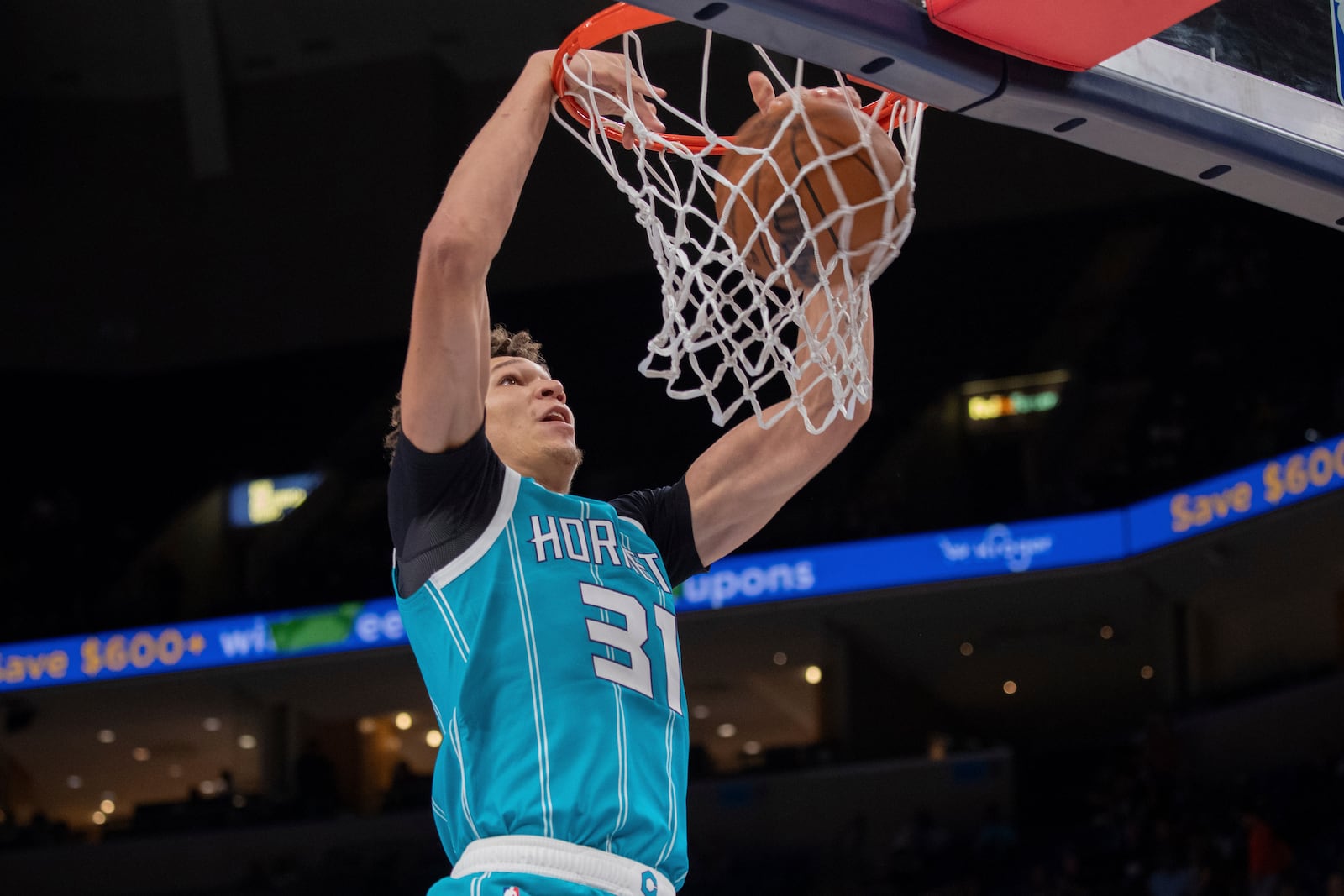 Charlotte Hornets' Tidjane Salaun (31), of France, dunks in the second half of a preseason NBA basketball game against the Memphis Grizlies, Thursday, Oct. 10, 2024, in Memphis, Tenn. (AP Photo/Nikki Boertman)