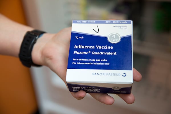 In this file photo, Katie Childress, LPN at Conyers Pediatrics, displays a box of the Influenza Vaccine at the Conyers office.