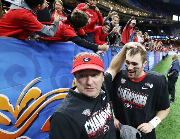 Georgia head coach Kriby Smart and quarterback Jake Fromm celebrate the 26-14 victory over Baylor in the Sugar Bowl Wednesday, Jan. 1, 2020, at the Mercedes-Benz Superdome in New Orleans.  