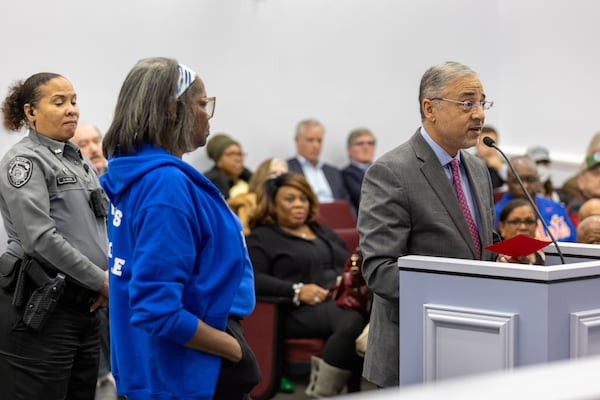 Rockdale County Attorney M. Qader A. Baig (right) advises the Board of Commissioners during a meeting in Conyers on Tuesday, Dec. 10, 2024. Several people called for the shutdown of BioLab, following a fire at the facility in September that produced a toxic chemical cloud. (Arvin Temkar / AJC)