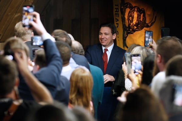 While Donald Trump leads in early primary polls in Georgia and other battleground states, some Republicans are encouraging a fresh look at  a growing field of GOP contenders who aim to sideline him, including Florida Gov. Ron DeSantis, center. Miguel Martinez / miguel.martinezjimenez@ajc.com