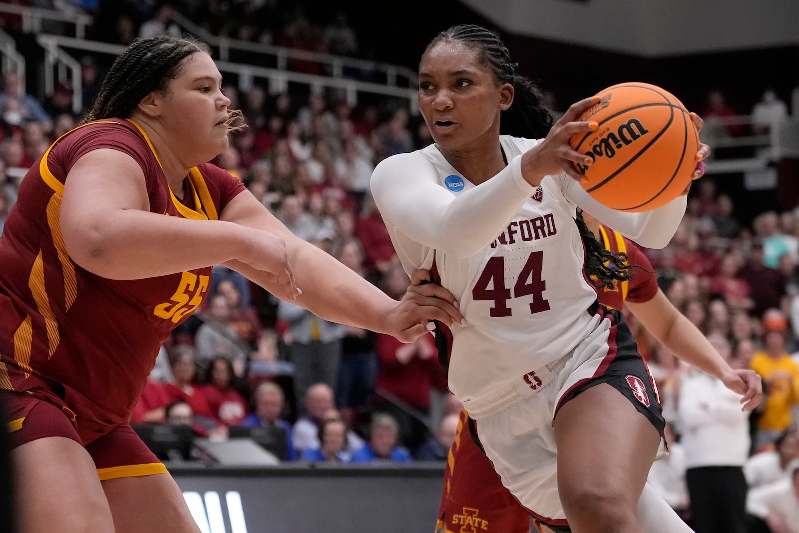 FILE -Stanford forward Kiki Iriafen (44) drives to the basket against Iowa State center Audi Crooks during the second half of a second-round college basketball game in the women's NCAA Tournament in Stanford, Calif., Sunday, March 24, 2024. (AP Photo/Jeff Chiu, File)