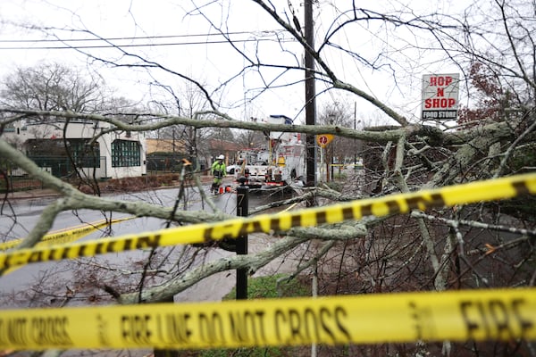 Georgia Power crews work to restore service after a tree fell in Decatur.


