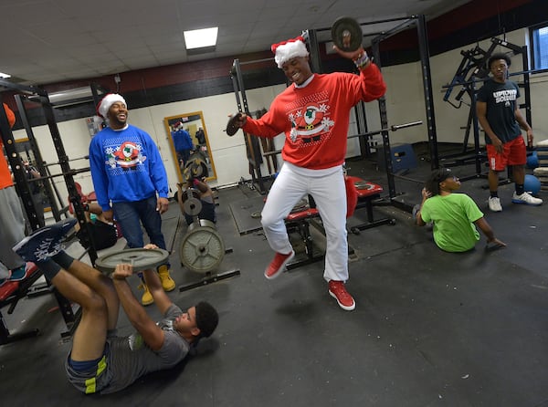 The Harding High School received athletic gear and $7,500 check for a new weight room as part of Newton's annual Santa Cams Surprise Sleigh on December 15, 2015 in Charlotte, N.C. Photo by Grant Halverson/Getty Images for Universal Pictures