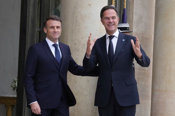 France's President Emmanuel Macron, left, welcomes NATO Secretary General Mark Rutte prior to a meeting at the Elysee Palace, in Paris, France, Tuesday, Nov. 12, 2024. (AP Photo/Michel Euler)