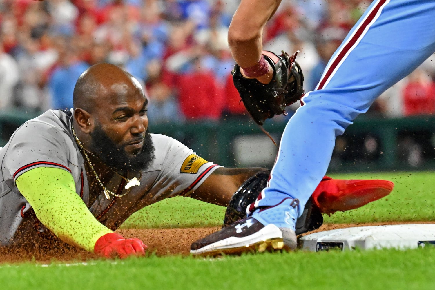 Atlanta Braves’ designated hitter Marcell Ozuna dives into third base after a single against the Philadelphia Phillies by Matt Olson during the ninth inning of NLDS Game 4 at Citizens Bank Park in Philadelphia on Thursday, Oct. 12, 2023.   (Hyosub Shin / Hyosub.Shin@ajc.com)