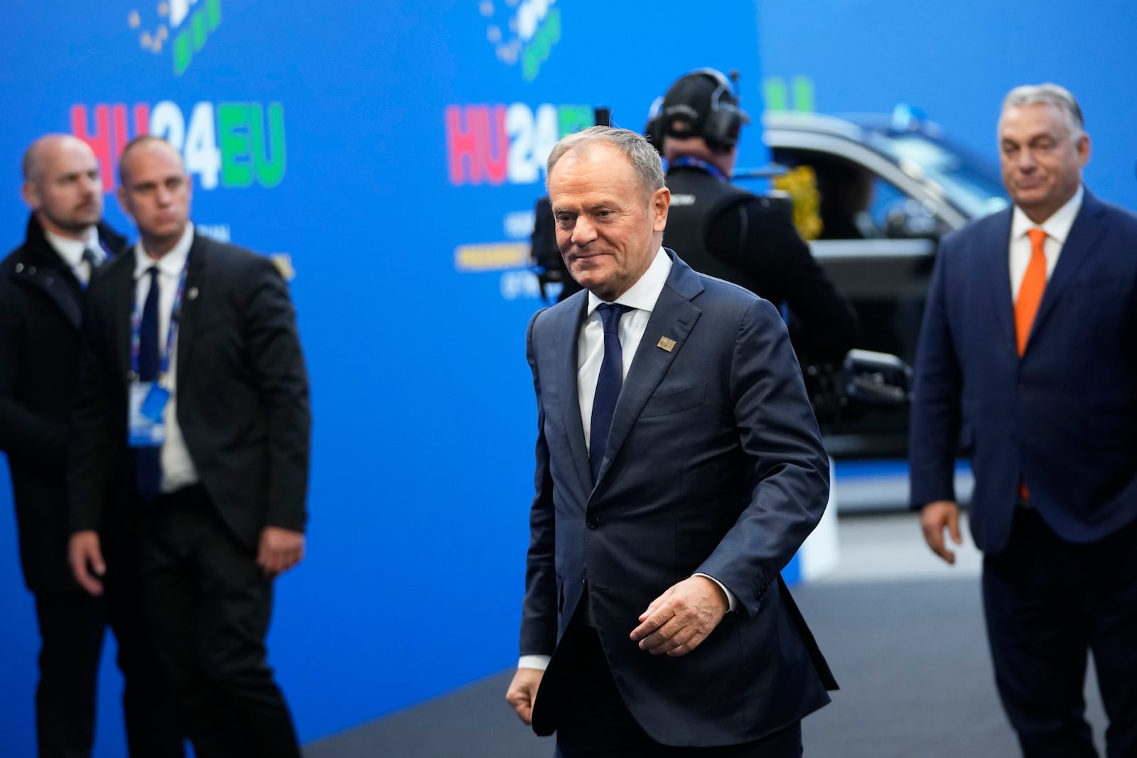 Poland's Prime Minister Donald Tusk, center, arrives for an EU Summit at the Puskas Arena in Budapest, Hungary, Friday, Nov. 8, 2024. (AP Photo/Petr David Josek)