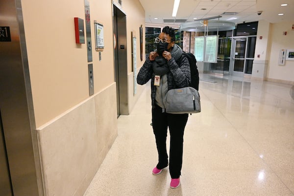 Dr. Erine Raybon-Rojas arrives for her night shift at Northeast Georgia Medical Center in Gainesville on Wednesday. “Walking up to our COVID ICU, walking in the door, I have a physical response,” she said. “Palpitations, sweat and a feeling of shortness of breath because every time I walked through those doors, it reminds me of when this started. And then I start to think, when is this going to end?” (Hyosub Shin / Hyosub.Shin@ajc.com)