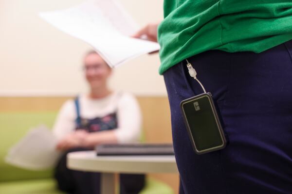 Diabetes Educator Justyna Zabinski wears an insulin pump as she talks with a patient’s mother at the Children’s Healthcare of Atlanta Center for Advanced Pediatrics, Wednesday, June 12, 2024, in Atlanta. Zabinski is one of several full time diabetes educators who also have type 1 diabetes. (Jason Getz / AJC)
