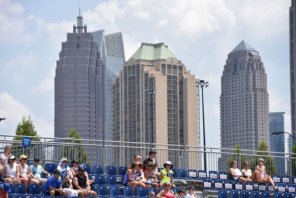 Amid the striking Midtown setting, spectators watch a match between Vasek Pospisil of Canada and Yen-Hsun Lu of Chinese Taipei during the BB&T Atlanta Open at Atlantic Station in 2015. HYOSUB SHIN / HSHIN@AJC.COM