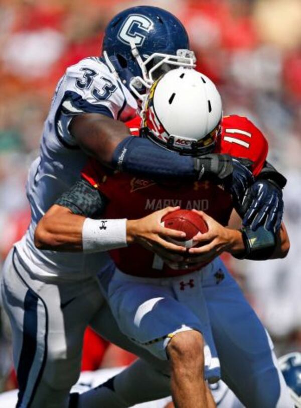 Connecticut linebacker Yawin Smallwood (33) sacks Maryland quarterback Perry Hills during the first half of an NCAA college football game in College Park, Md., Saturday, Sept. 15, 2012. (AP Photo/Patrick Semansky) Photo: Patrick Semansky, ASSOCIATED PRESS