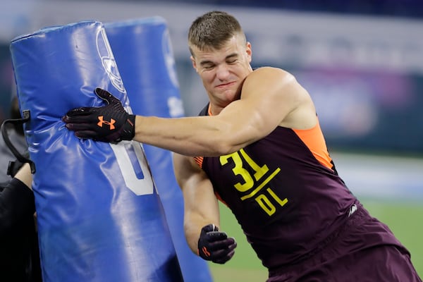 Charleston defensive lineman John Cominsky runs a drill during the NFL football scouting combine, Sunday, March 3, 2019, in Indianapolis. (AP Photo/Darron Cummings)