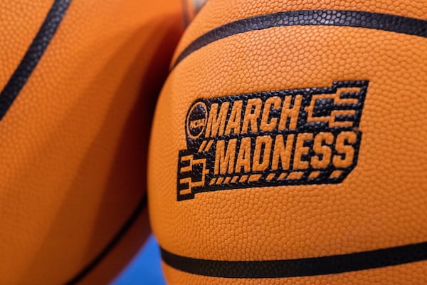 FILE - Two basketballs sit on the floor before a second round game between UCLA and Oklahoma in the NCAA college basketball tournament, Monday, March 20, 2023, in Los Angeles, Calif. (AP Photo/Kyusung Gong, File)