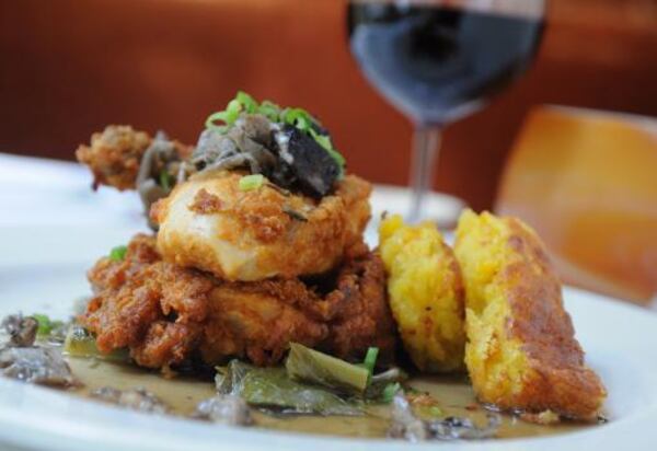 You can get your collard greens braised with bacon and served with skillet fried chicken, sweet corn pudding and mushroom-herb broth at Wisteria.