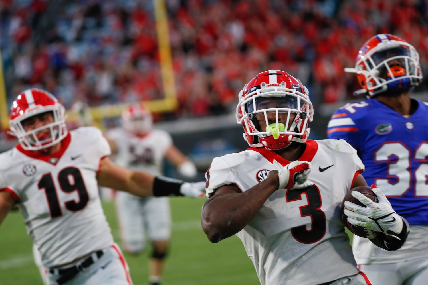 10/30/21 - Jacksonville -  Georgia Bulldogs running back Zamir White (3) scores on this 4th quarter touchdown run during the second half of the annual NCCA  Georgia vs Florida game at TIAA Bank Field in Jacksonville. Georgia won 34-7.  Bob Andres / bandres@ajc.com