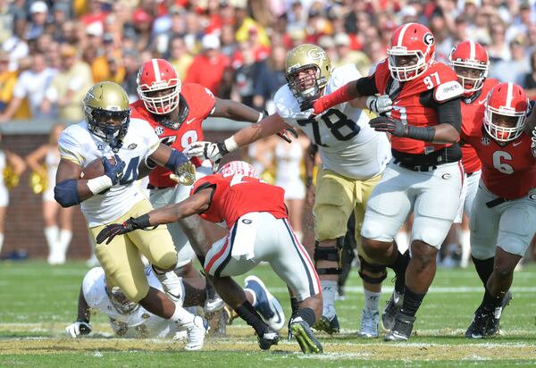 November 28, 2015 Atlanta - Georgia Tech Yellow Jackets running back Marcus Marshall (34) breaks away for a first down in the first half at Bobby Dodd Stadium on Saturday, November 28, 2015. HYOSUB SHIN / HSHIN@AJC.COM