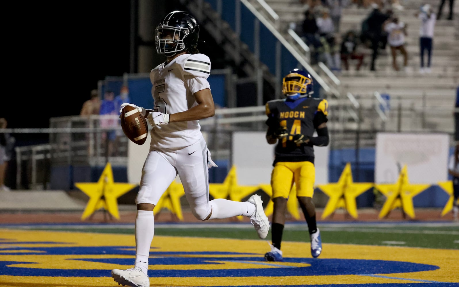 Alpharetta wide receiver Jaden Slocum (5) runs into the end zone for a touchdown after a long catch in the second half against Chattahoochee at Chattahoochee high school Friday, September 25, 2020 in Johns Creek, Ga.. Alpharetta won 21-7. JASON GETZ FOR THE ATLANTA JOURNAL-CONSTITUTION